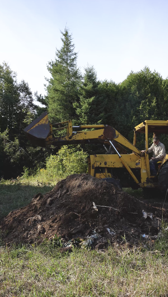 local Ontario farmer moving soil, beginning of our whole freeze dried fruit process