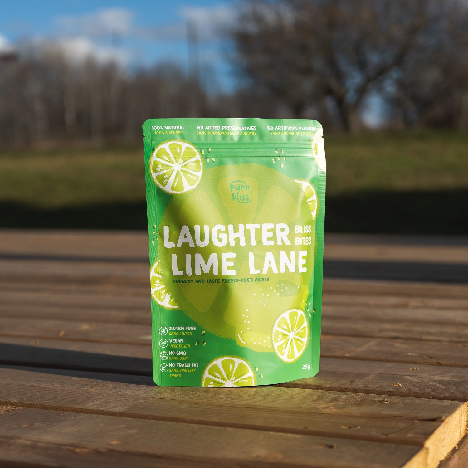  'Laughter Lime Lane' package on a wooden surface with a blurred natural background