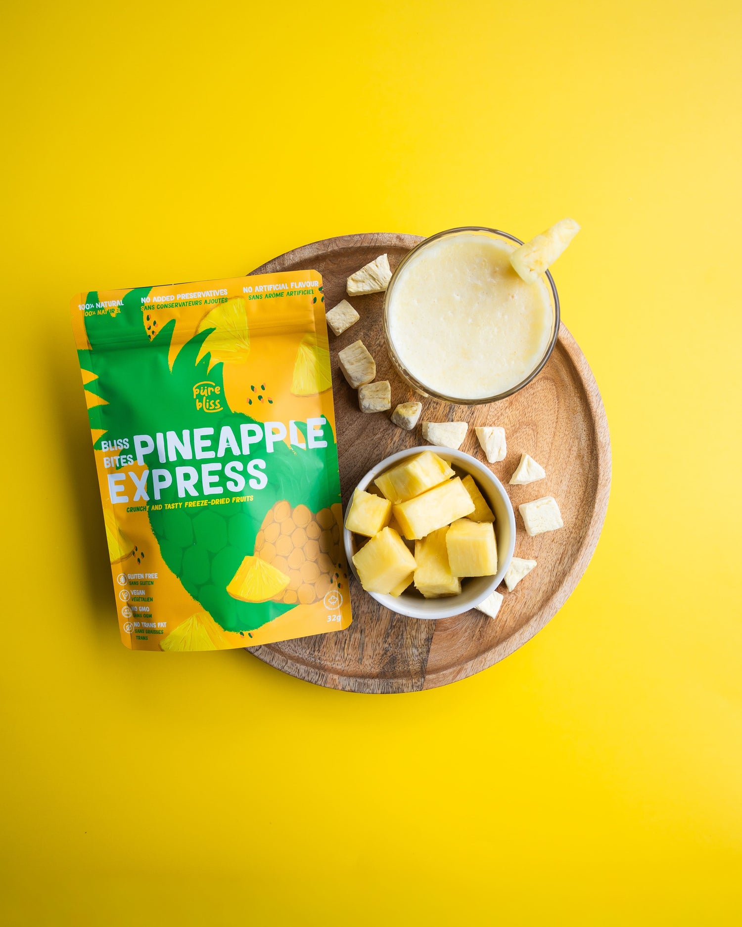 Pineapple Express snack package with a smoothie and pineapple chunks on a yellow background