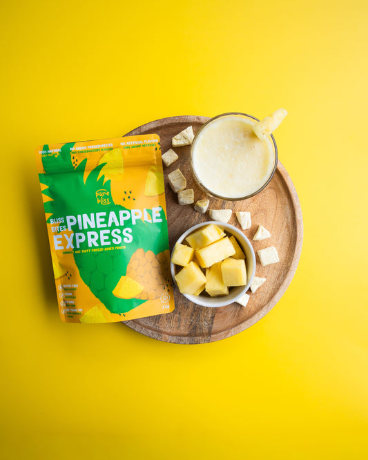 Pineapple Express snack package with a smoothie and pineapple chunks on a yellow background